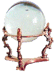 a clear crystal ball on a small gold pedistal
